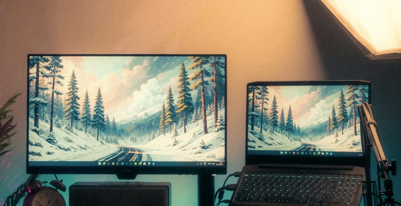 Workspace with computer screens and no people